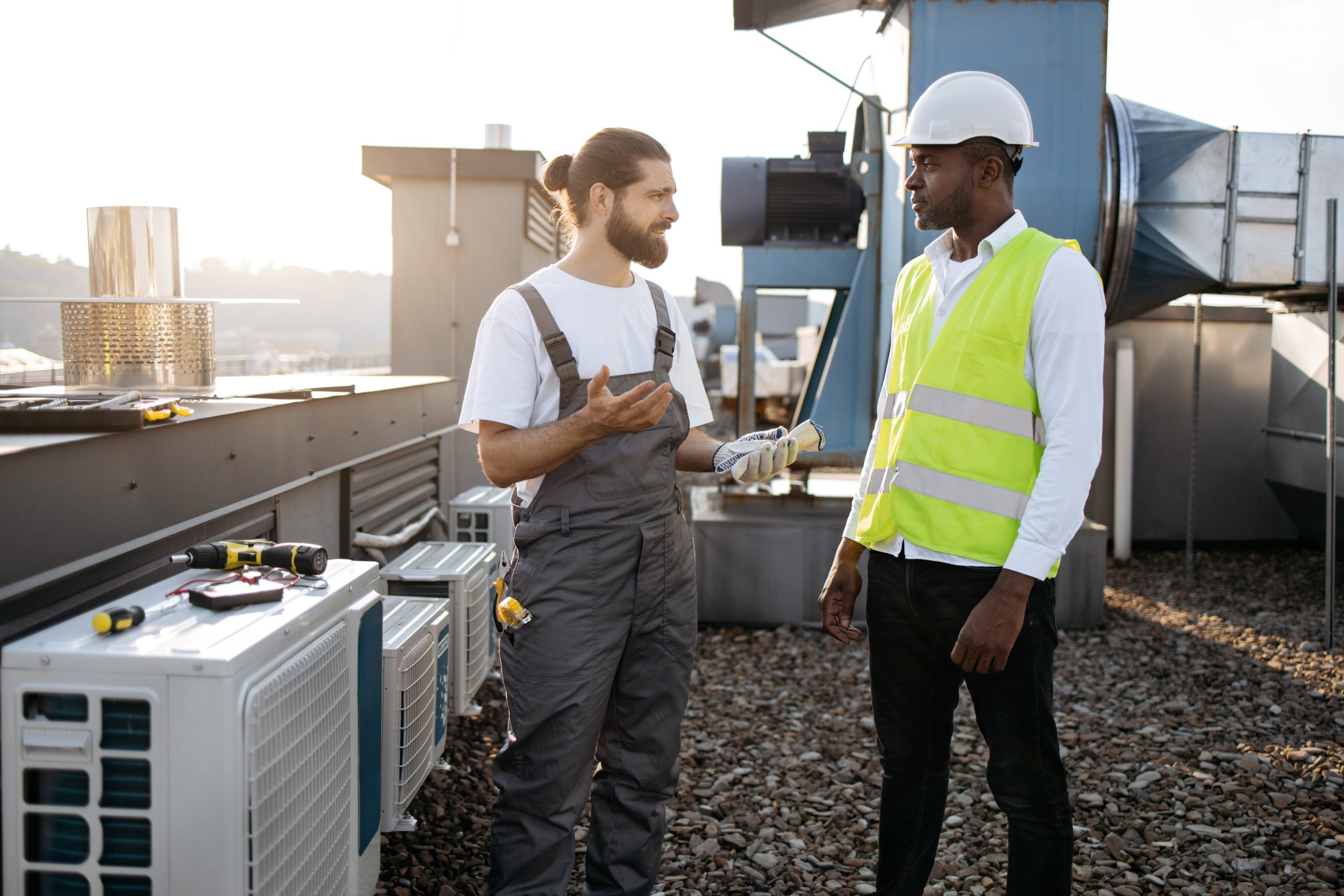 Diverse craftsmen standing and discussing issues outdoor